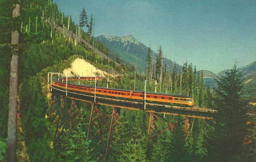 Olympian Hiawatha streamliner crossing a trestle in the Cascade mountains